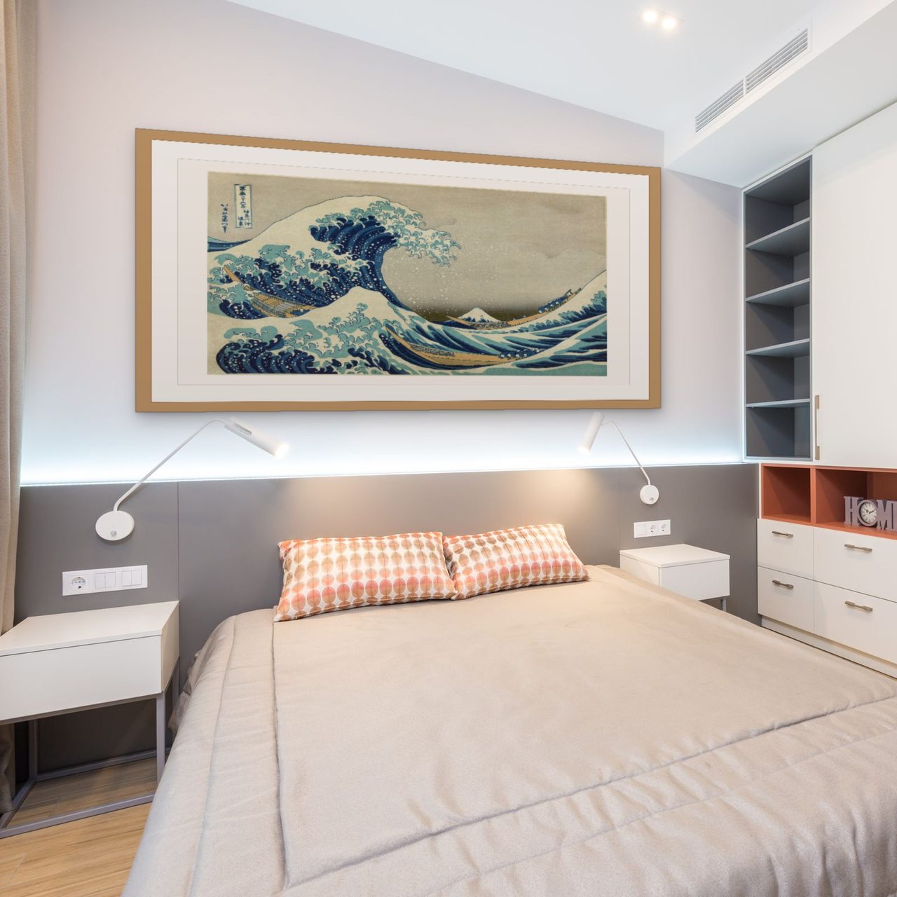 A framed Hokusai woodblock print hanging above a bed